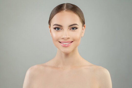 Lovely smiling woman portrait. Healthy woman face. Facial treatment, skincare and spa concept
