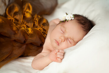 Cute little newborn child girl sleeping peacefully