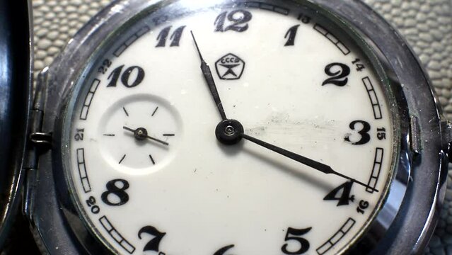 Arrows rotate on a mechanical clock watch