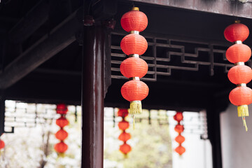 Traditional colorful lanterns spread light on the old building in China