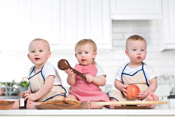 three toddlers on the kitchen table, baby food mockup