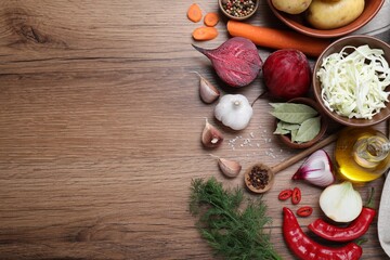 Fresh borscht ingredients on wooden table, flat lay. Space for text