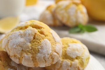 Fresh delicious lemon cookies on table, closeup