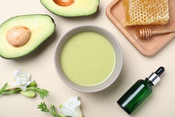Homemade hair mask and ingredients on beige background, flat lay