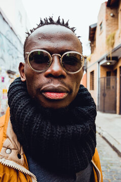 close up vertical portrait of serious african man outdoors