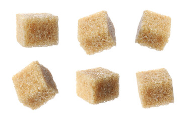 Set with cubes of brown sugar on white background