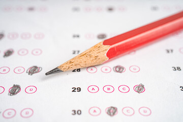 Answer sheets with pencil drawing fill to select choice, education concept.