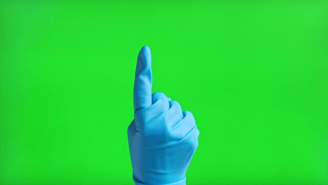 Gestures pack. Hand in medical gloves touching, clicking, tapping and swiping on chromakey green screen. Zoom in, zoom out. Close up. 4K Footage. Using smartphone, tablet pc or touch screen devices.