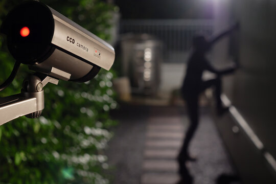 CCTV Surveillance camera capturing thief during breaking into house