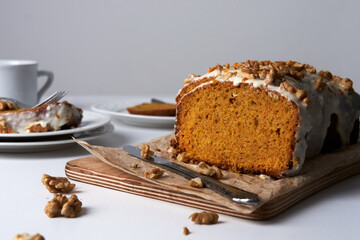 Delicious homemade carrot cake with nuts for snack on wooden table. Food concept.