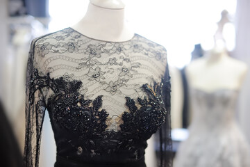 Beautiful dresses on mannequin in wedding salon or atelier sewing studio. Wedding exhibition or...