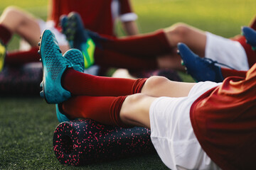 Soccer Football Players in a Team on Fitness Workout to Relieve Muscle Tightness, Soreness, and...
