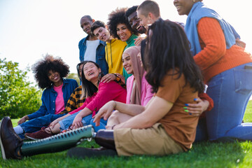 Group of different ethnic origin together having a good time together outdoors