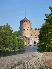 Fototapeta na wymiar Summer view of the old Olavinlinna fortress in the Finnish city of Savonlinna.