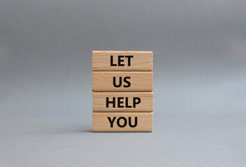 Let us help you symbol. Wooden blocks with words ILet us help you. Beautiful grey background. Business and Let us help you concept. Copy space.
