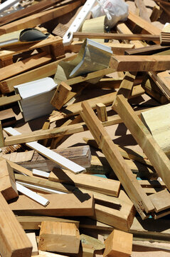 Pile of wood scraps. Remains of wood from the construction of a building. Pile of wood waste for recycling of construction materials