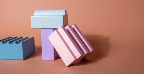 Bright, colorful geometric shapes podium for product display. Multicolored architecture of abstract...