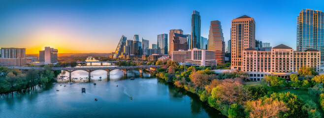 Austin, Texas- Panoramic cityscape and Colorado River against the sunset sky - obrazy, fototapety, plakaty