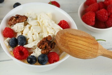 croissant breakfast with cheese, berries and nuts. Hearty and healthy food.