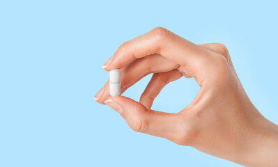 Pill of antibiotic in doctor hand. Pharmacy, pharmacology, medicine concept
