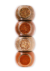 Various spices in a bowls on white