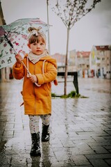 little girl with umbrella goes in the center from varna bulgaria 