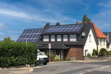 House with solar panels attached to the roof. New eco technology of electricity generation....