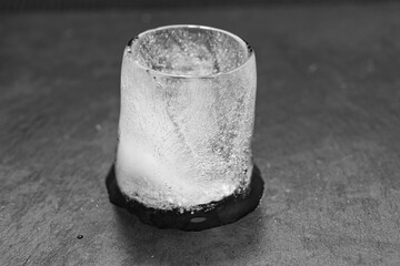 the process of melting an ice cube. black-and-white. 