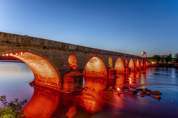 Meric River and the bridge in Edirne, Turkey. Sunset at Mimar Sinan Bridge at Meric river