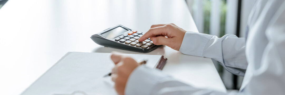 Business Professional Chartered Accountant Woman working with computer and calculator Sales Invoice Accounting