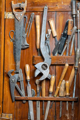 Set of old tools on wood