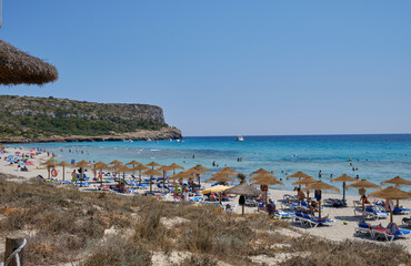 Menorca, Spain: Afternoon in Son Bou beach on a cold sunny day, Menorca, Spain