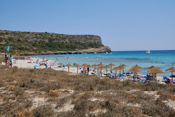 Fototapeta na wymiar Menorca, Spain: Afternoon in Son Bou beach on a cold sunny day, Menorca, Spain