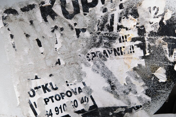 Obraz premium Old torn street poster advertisement background on a metal surface