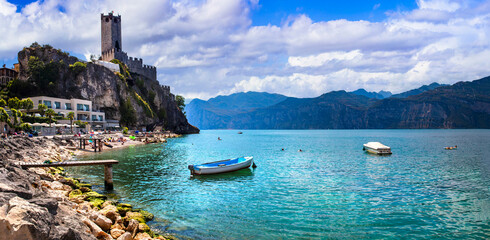 Amazing italian lake scenery - beautiful Lago di Garda. panoramic view of Malcesine castle and beach
