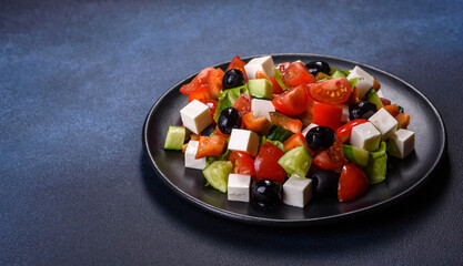 Greek salad with fresh vegetables, feta cheese and black olives