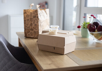 Junk fast food on the table at home brought by delivery service