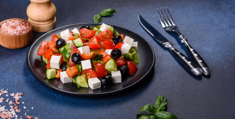 Greek salad with fresh vegetables, feta cheese and black olives