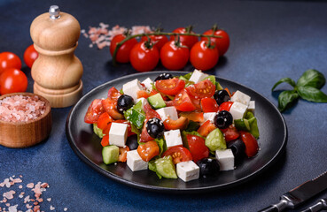 Greek salad with fresh vegetables, feta cheese and black olives