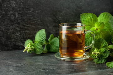 Mint tea on a black table.