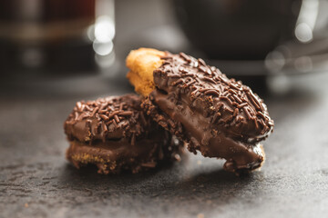 Petit fours with chocolate sprinkles. Mini chocolate dessert.
