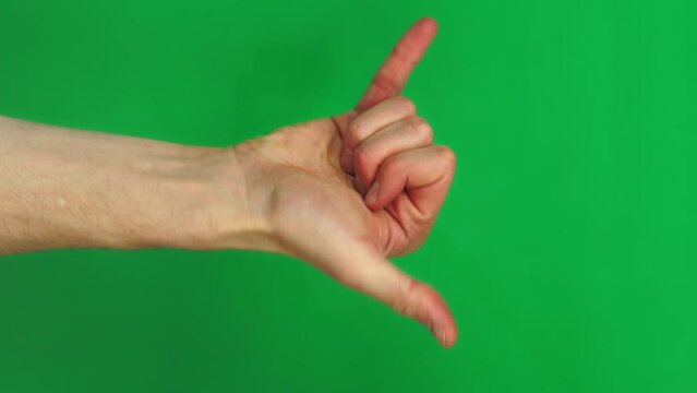 Package of 14 gestures shown by male Caucasian hands on chroma key background in closeup. Man is making various signs by fingers and arms changing position on greenscreen. He is wagging and applauding