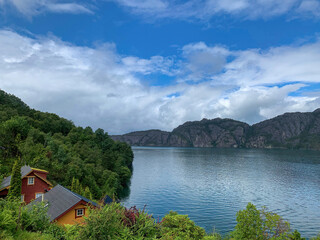 Norway fjords with little red houses at the water's edge 2