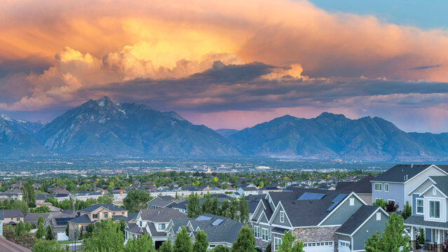 Panorama Dramatic sunset with clouds Panoramic view of Salt Lake City residential area in Utah