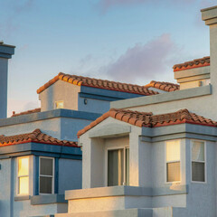 Square Puffy clouds at sunset Gray mediterranean style building with red concrete tile roofs a