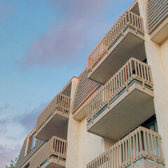 Square Puffy clouds at sunset Low angle view of an apartment building in Oceanside, California