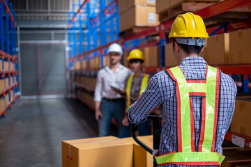 Young worker  working in an industrial place of work. logistics service, warehouse management and...