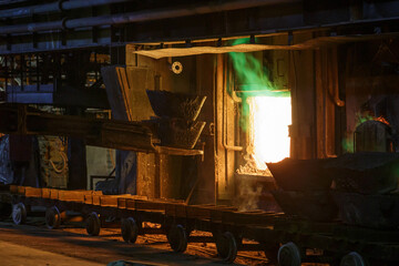 Fototapeta na wymiar The process of loading copper ore into a gas furnace.