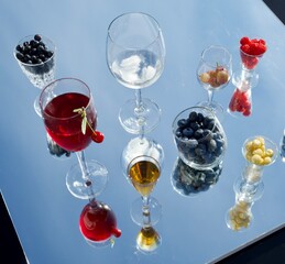 Cherry wine splash.Healthy food background,  berry harvest, wine and jam preparing