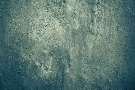 Pale grey-green texture. Painted old rough wall surface. Fieldgray color. Vintage background with space for design. Close-up. Obsolete, rustic.